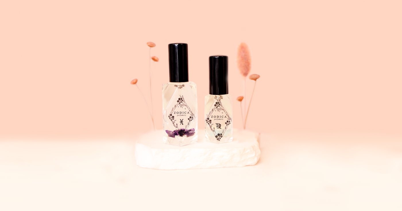 large crystal infused perfume bottle with pink trees