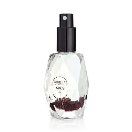 perfume bottle with black cap labeled 'Aries' on a white background