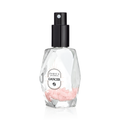 Zodica Cancer perfume bottle with rose quartz crystals on a white background