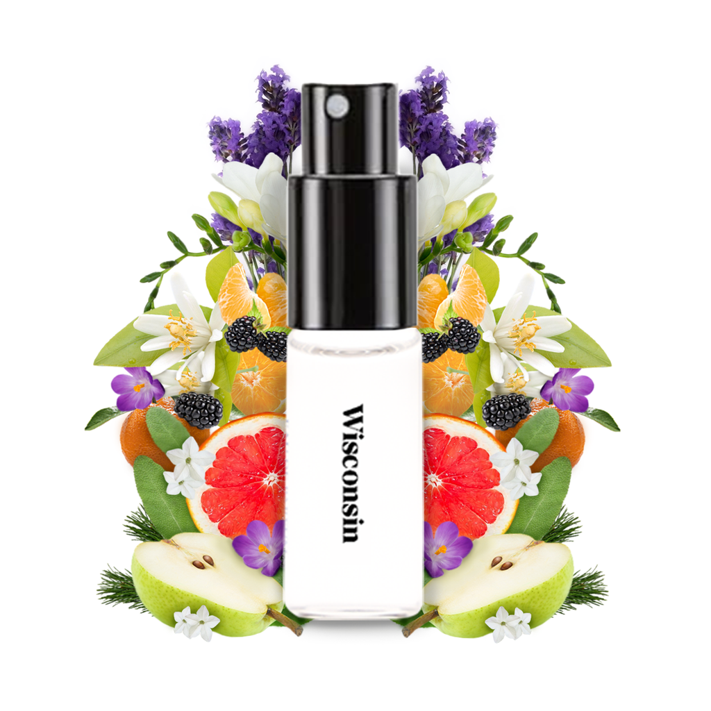 Wanderlust Wisconsin perfume 2ml spray bottle centered on a white background and surrounded by illustrated fruits, flowers, and leaves including purple lavender, red grapefruit, green pear, orange, blackberry, white flowers, and green leaves.